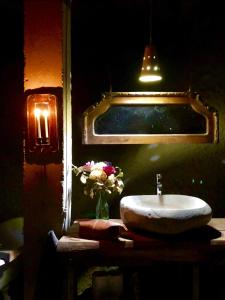a bathroom with a sink and a swimming pool at The Cave Of Wine by Casavino in Casablanca