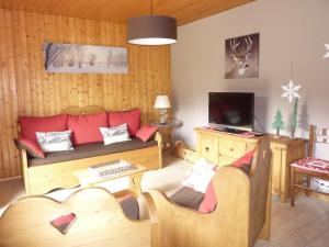 TV a/nebo společenská místnost v ubytování chalet trois étoiles