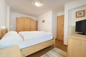 A bed or beds in a room at Appartamento Boschetto Giulia