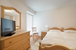 A bed or beds in a room at Appartamento Boschetto Giulia