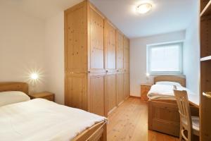 A bed or beds in a room at Appartamento Boschetto Giulia