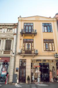 a building with a store in front of it at Somnia in Bitola