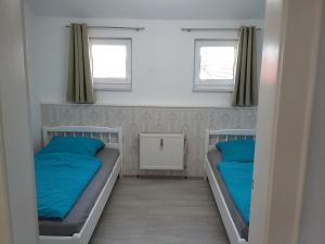 מיטה או מיטות בחדר ב-An den Linden 31
