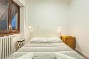 Postel nebo postele na pokoji v ubytování Residence Del Teatro Al Porto