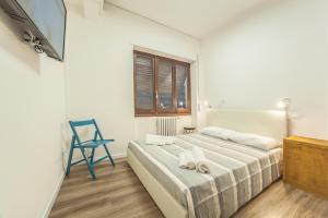 Postel nebo postele na pokoji v ubytování Residence Del Teatro Al Porto