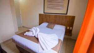 Voodi või voodid majutusasutuse Hotel Tepic toas
