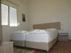 
Een bed of bedden in een kamer bij Oaza Inn
