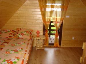 En eller flere senge i et værelse på Nadmorski Zakątek