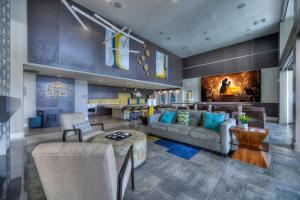a large living room with couches and a fireplace at Luxury Condos by Meridian CondoResorts- Scottsdale in Scottsdale
