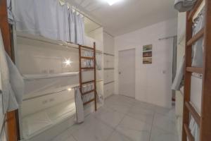 Cama ou camas em um quarto em Galinha d'Angola