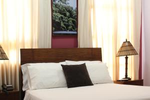 Rúm í herbergi á Hotel Solaris