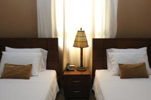 Rúm í herbergi á Hotel Solaris
