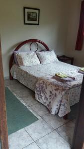 En eller flere senge i et værelse på Pousada Mandala Sana