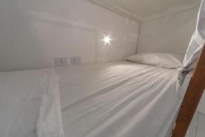 Cama ou camas em um quarto em Galinha d'Angola