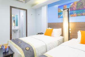 Кровать или кровати в номере 4M Pratunam Hotel