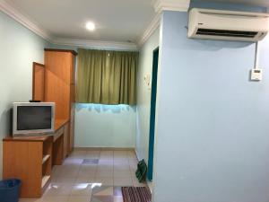 a living room with a tv and a room with at Hotel Seri Kangsar KK Hotel in Kuala Kangsar +42 photos