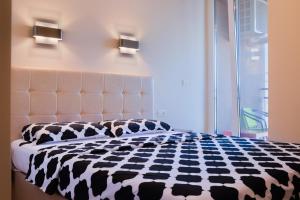 Ένα ή περισσότερα κρεβάτια σε δωμάτιο στο Pavel's Apartment