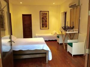 Una cama o camas en una habitación de Dapitan Beach Villa 9 fotos más
