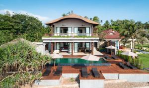 an aerial view of a house with a swimming pool at Saai Resort in Bang Saphan Noi