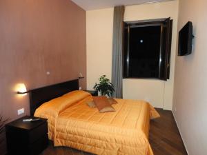 Posteľ alebo postele v izbe v ubytovaní B&B Il Campanile