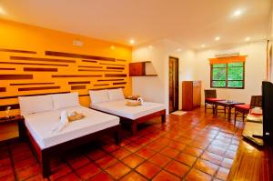 Posteľ alebo postele v izbe v ubytovaní Acacia Tree Garden Hotel