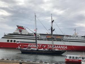 a large red and white ship in the water at 3ree- Spacious & Charming Apartment in Devonport
