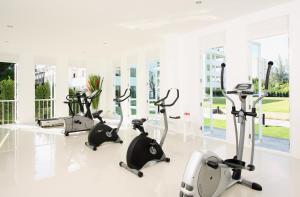 a gym with cardio bikes and treadmills at The Old Phuket - Karon Beach Resort - SHA Plus in Karon Beach