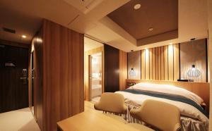 A bed or beds in a room at N Hotel