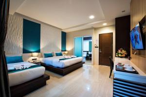 Postel nebo postele na pokoji v ubytování The Nice Krabi Hotel + 36 fotografií