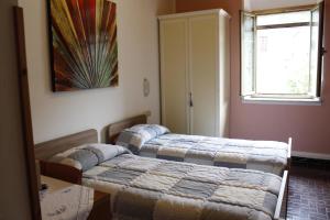 Postel nebo postele na pokoji v ubytování Albergo Elisa