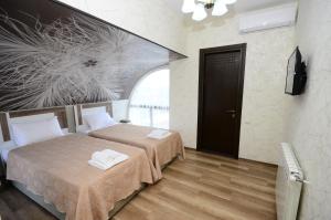 Postel nebo postele na pokoji v ubytování Dream Tower
