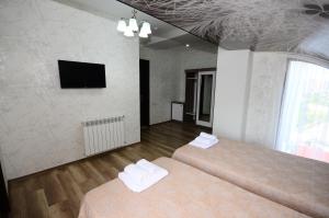Postel nebo postele na pokoji v ubytování Dream Tower