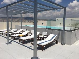a swimming pool on the roof of a building at Piraeus Theoxenia Hotel in Piraeus