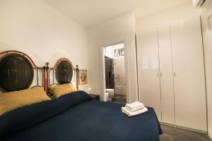 A bed or beds in a room at Casa 34 Dicembre