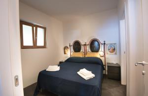 A bed or beds in a room at Casa 34 Dicembre