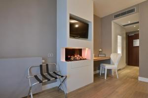 TV a/nebo společenská místnost v ubytování Van der Valk Hotel Groningen-Westerbroek