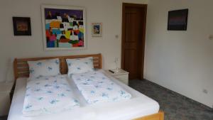 Ένα ή περισσότερα κρεβάτια σε δωμάτιο στο Haus Olympia