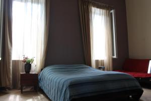 Postel nebo postele na pokoji v ubytování L House