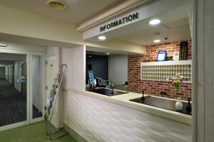 a counter in a hospital with two sinks at Hotel Johzenji in Sendai