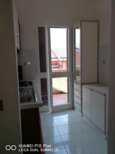 Kuchyňa alebo kuchynka v ubytovaní Villa Galilei Rooms