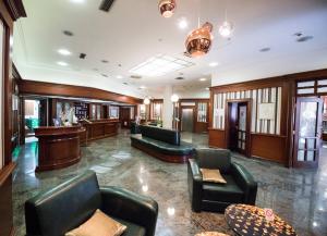a lobby with couches and a bar at Kopernikus Hotel Prag in Belgrade