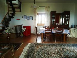 a kitchen and dining room with a table and chairs at La dimora di Radha B&B Centro Olistico in Rende
