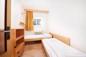 Postel nebo postele na pokoji v ubytování Hotel Červenohorské sedlo