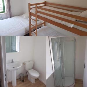 a bathroom with a bunk bed and a toilet and a sink at CHAMBRES / BEDROOM in Pleine-Fougères
