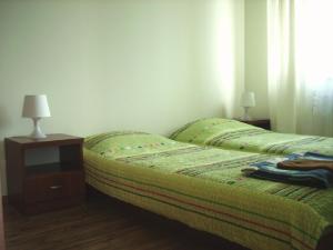Posteľ alebo postele v izbe v ubytovaní Apartamenty Jasna