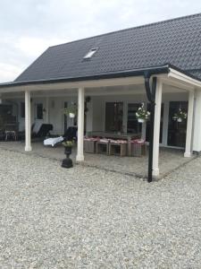 a house with a roof and a patio at Casa Martin in Porumbacu de Sus