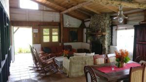 a living room with a table and a couch at Villa Pajon Eco Lodge in Constanza