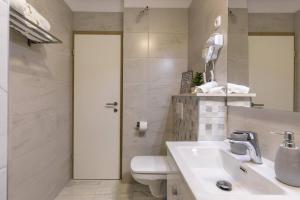 Koupelna v ubytování Apartments Cezar