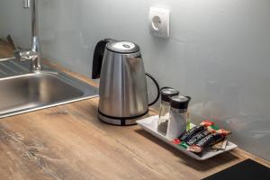 Kuchyň nebo kuchyňský kout v ubytování Apartments Cezar