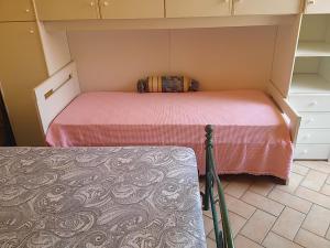 A bed or beds in a room at Amber Apartment